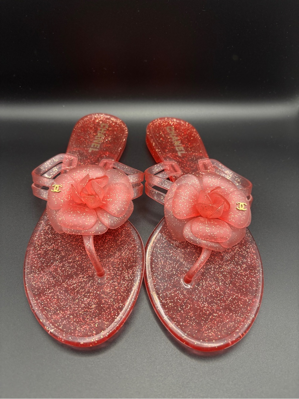 CHANEL Red Glitter Jelly Sandals with Camellia Accent